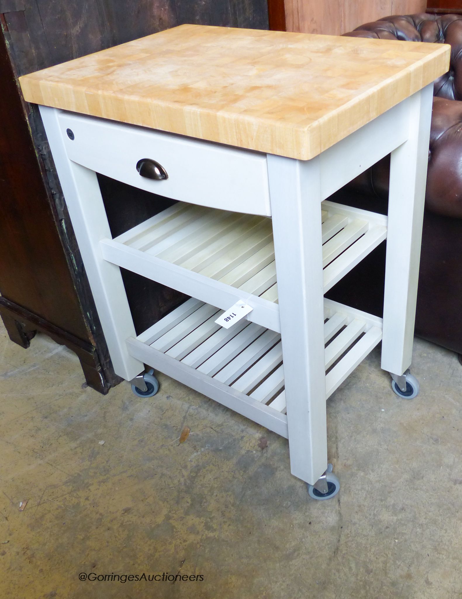 A T&G painted beech topped butchers block. W-70, D-50,H-89.
